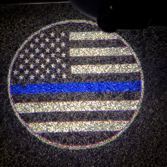 The thin blue line flag projected on the pavement