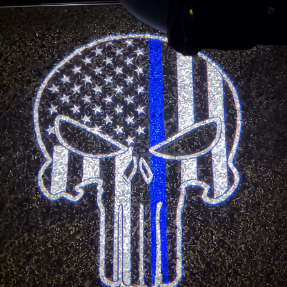 The thin blue line Punisher skull projected on the pavement