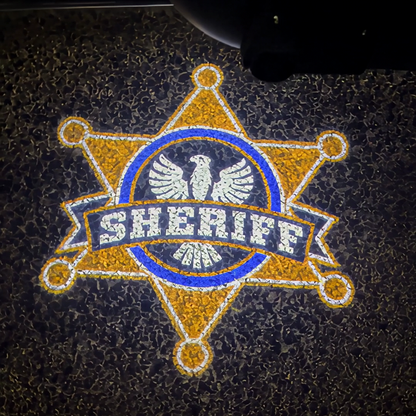 The sheriff's star projected on the pavement