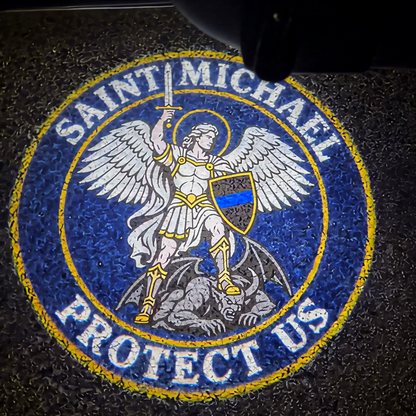 The Saint Michael badge projected on the pavement
